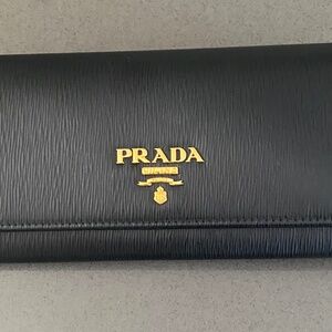 Prada Large    Black Wallet with Red Interior Large.